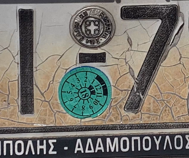 How do I find out if a vehicle tax is paid in Greece?