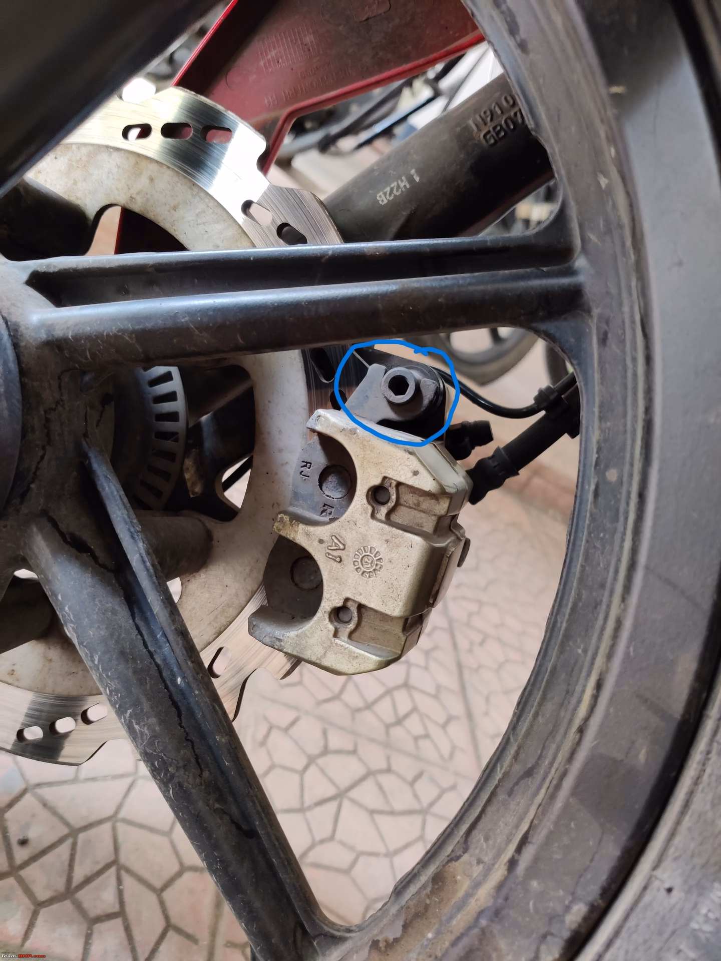 What happens if a motorcycle brake rotor is warped?