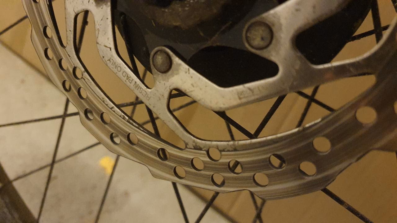What happens if a bike rotor is contaminated?