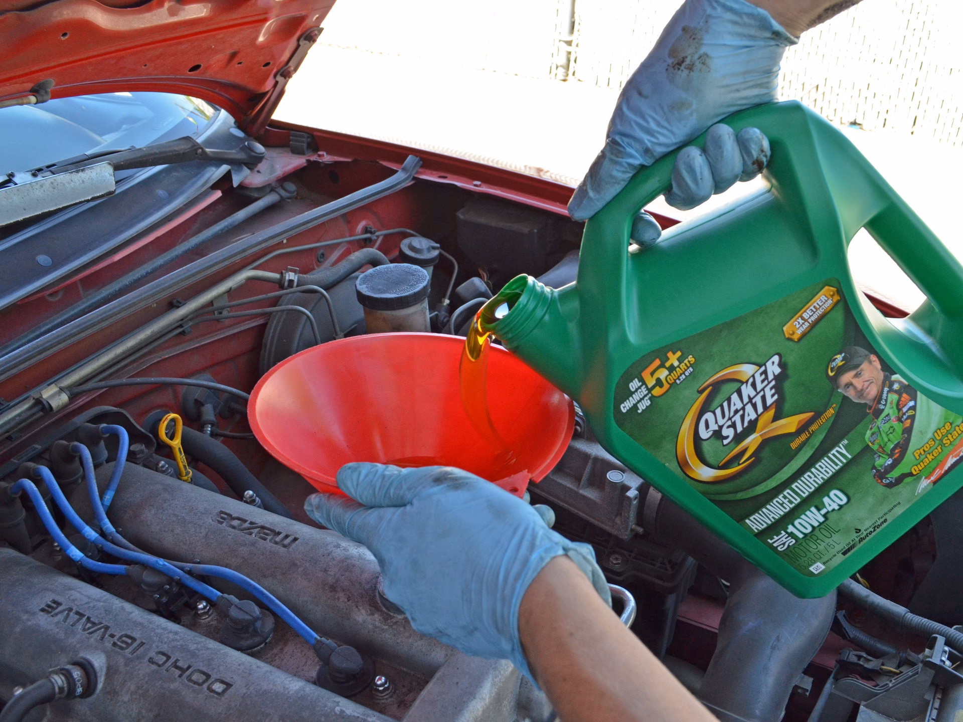 How do you change engine oil on a Ford Miata?