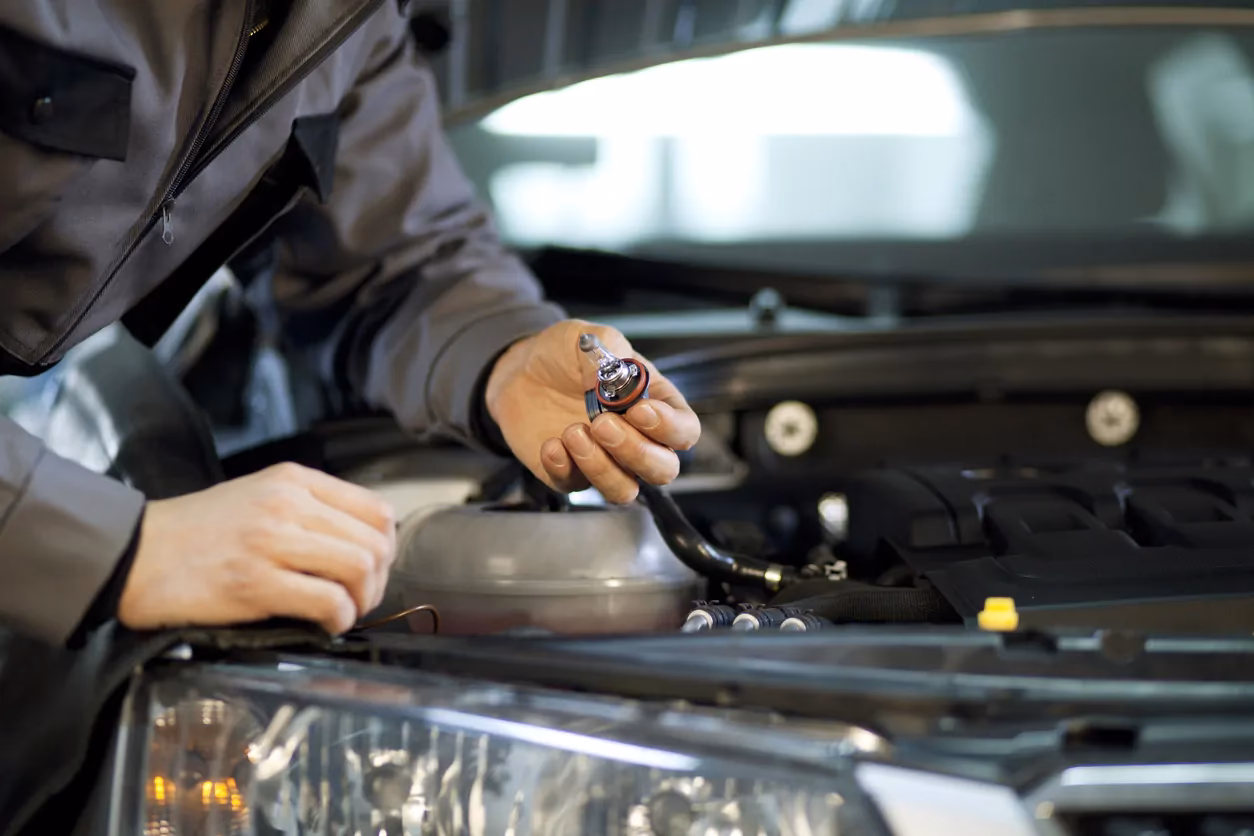 How do you change a car headlight bulb?