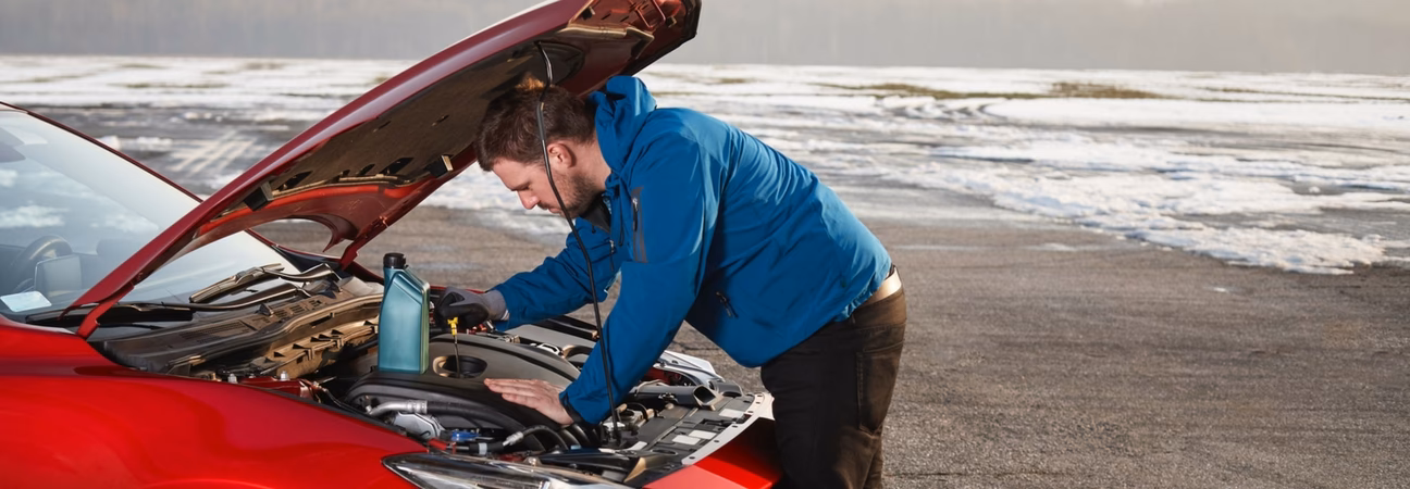 What causes a wet engine belt to clog the oil pump?