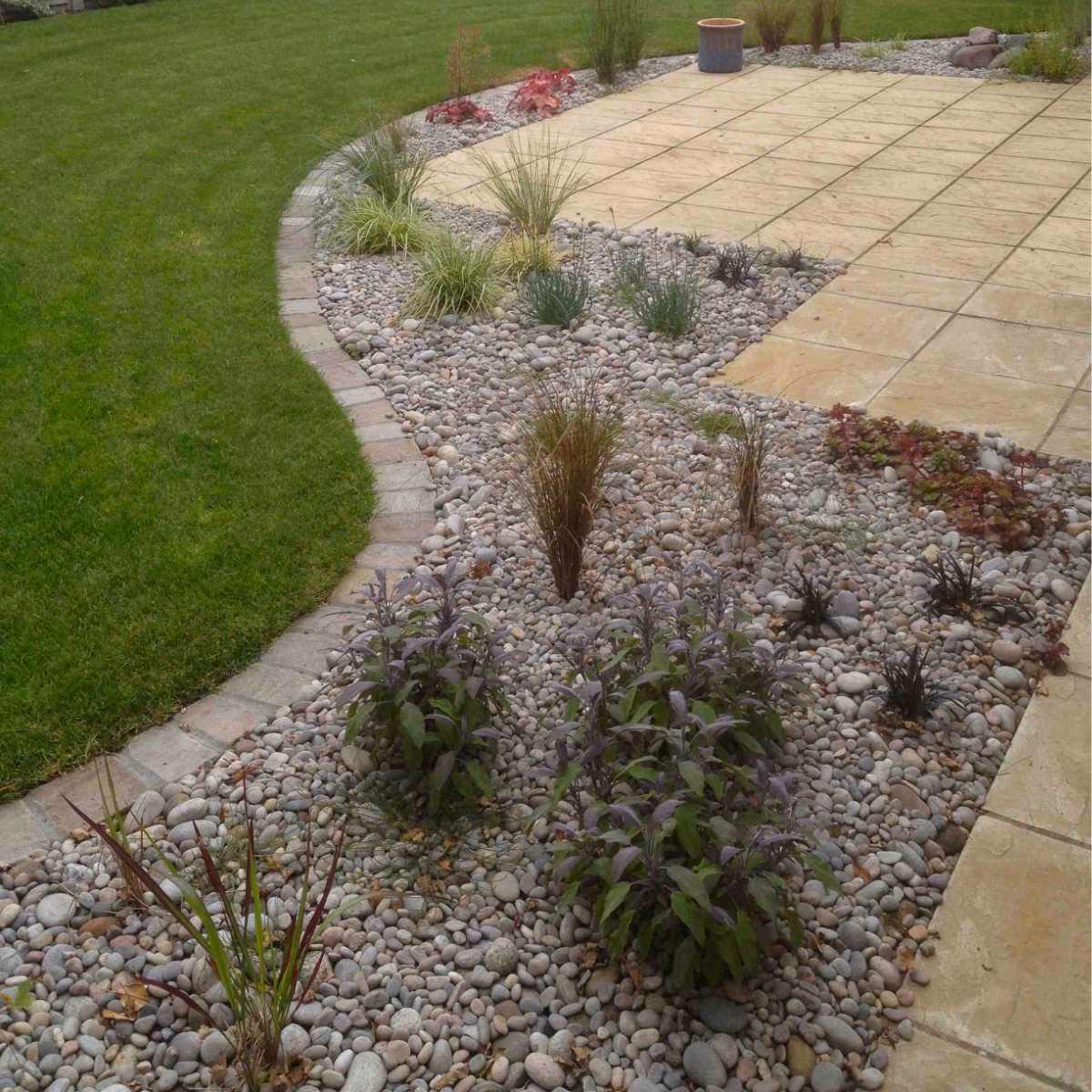 Why do you need raised edging on a patio?