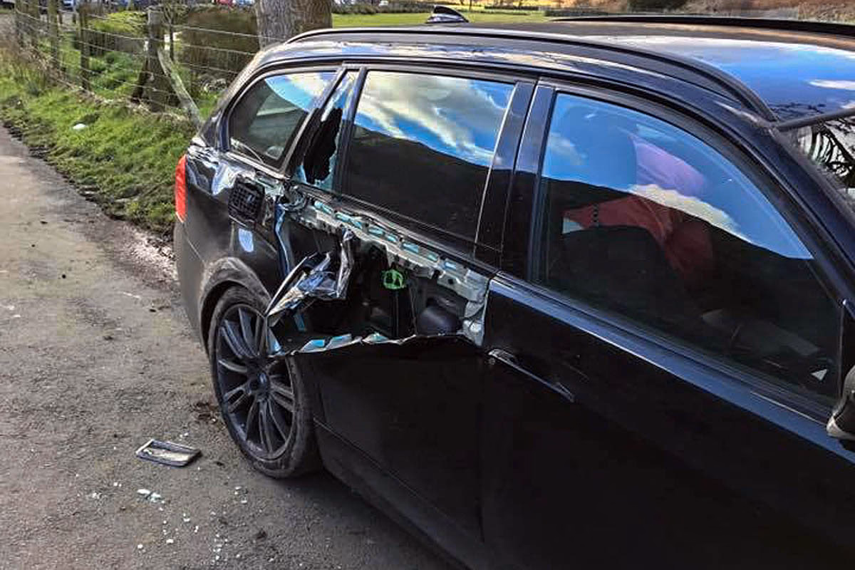 Can villagers help repair a war memorial damaged by a car?