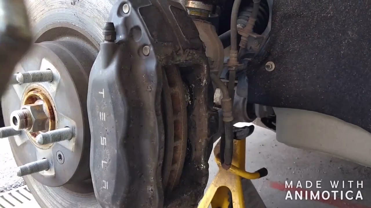 How do you install a rear brake caliper?