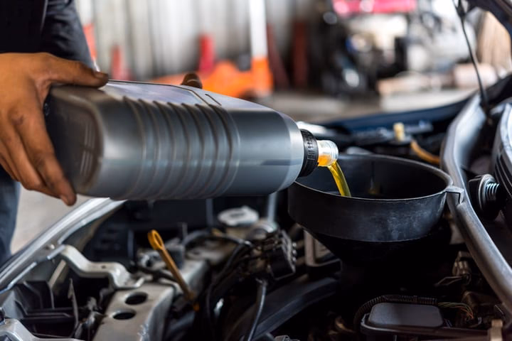 How do I top up my engine oil?