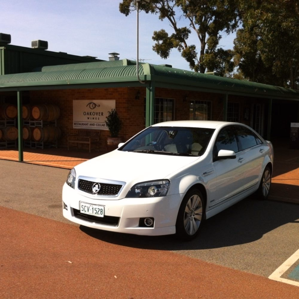 What do Town Cars Australia chauffeurs wear?