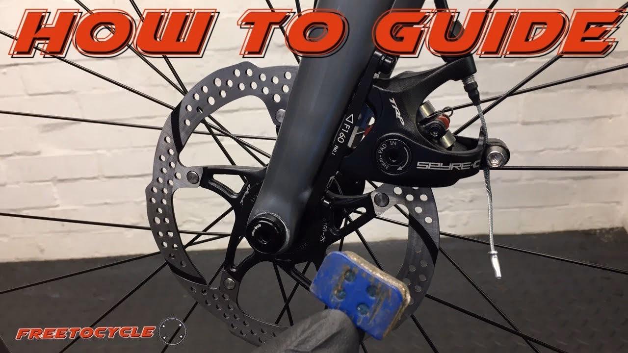 How do you install a rotor caliper on a TRP disc brake?