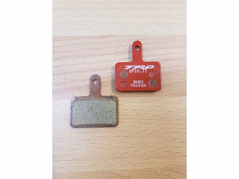 How do you install a rotor caliper on a TRP disc brake?