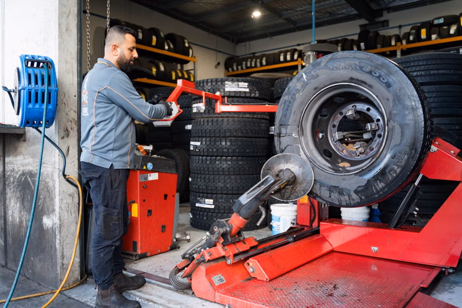 Why should I schedule a heavy vehicle wheel alignment service?