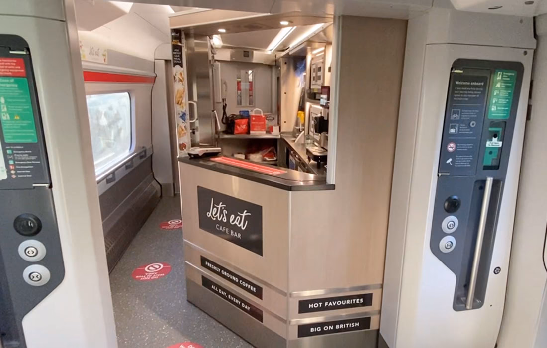 How can I collect a ticket from a self-serve ticket machine?