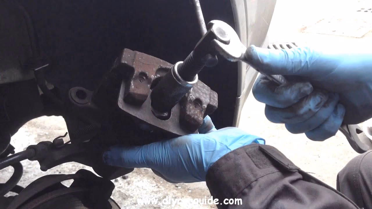 How do I adjust the handbrake on my Vectra hatchback?