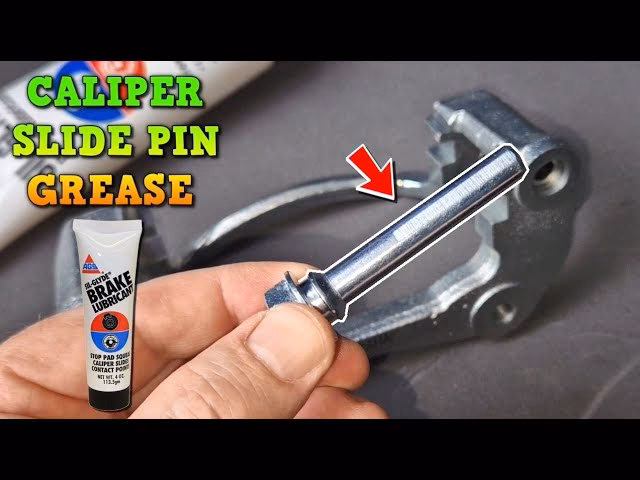 Why is caliper slide pin grease important?