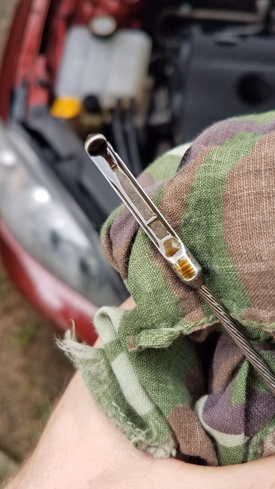 How do you clean the oil on a 2023 Mazda 3?