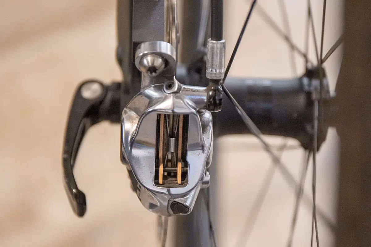 Do bike disc brake pads wear down?