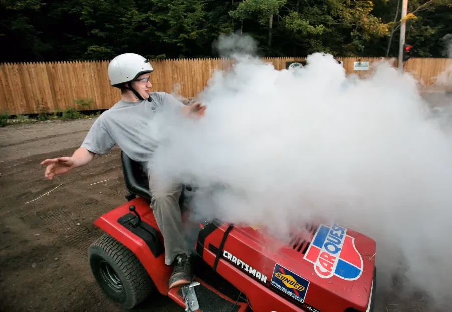 How do you fix a white smoke on a lawn mower?