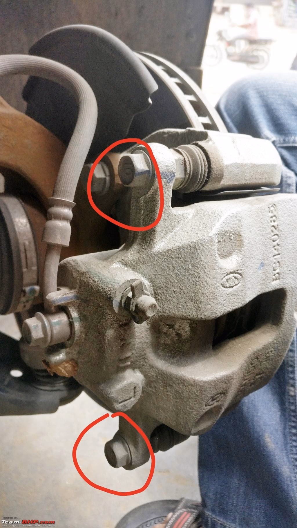 What causes one sided brake pad wear?