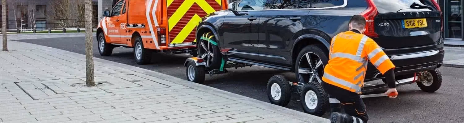 Can I tow a car home using a rigid bar?