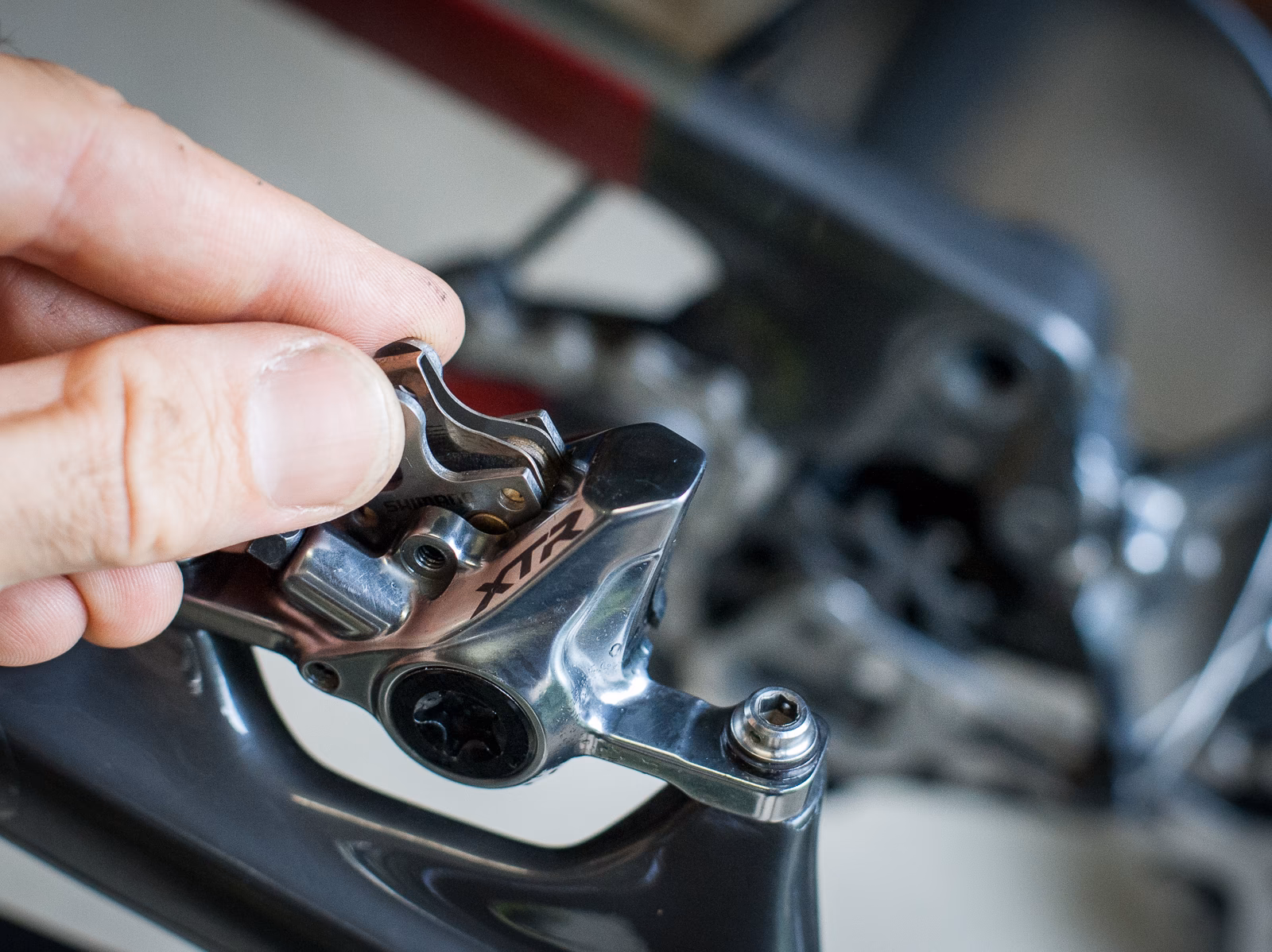 How do you remove brake pads from a car?