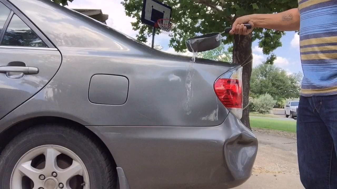 How do you fix a dent on a car bumper?